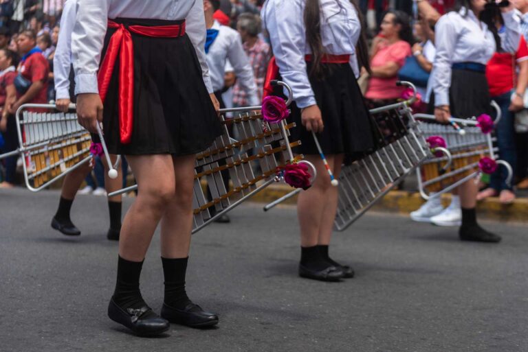 Girls carrying xylophones in Costa Rica's Independence Day parade